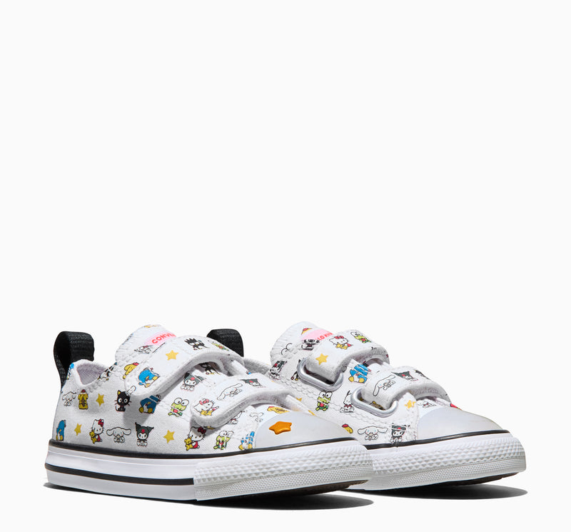 Toddler low-top sneakers front view, white canvas with character print and hook strap