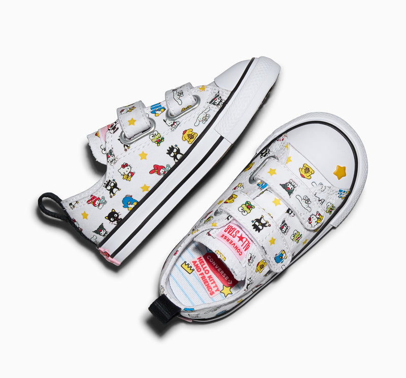 Toddler sneakers, white canvas with character print and black trim, hook strap closure