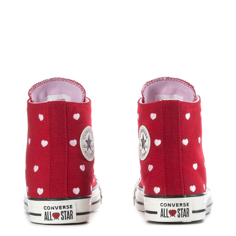 Red high-top sneakers with white heart print, heel tab, and Converse All Star branding
