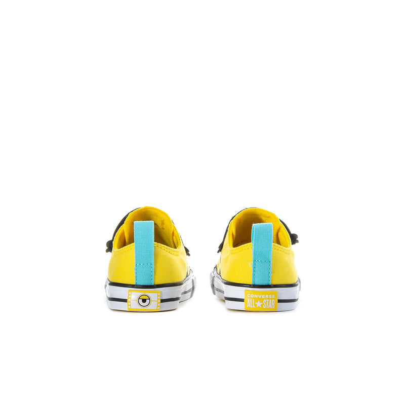 Toddler one-strap sneaker, heel view: yellow canvas with blue pull tab and white sole