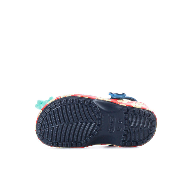 Kids' clog outsole view with blue tread and textured sidewall grip