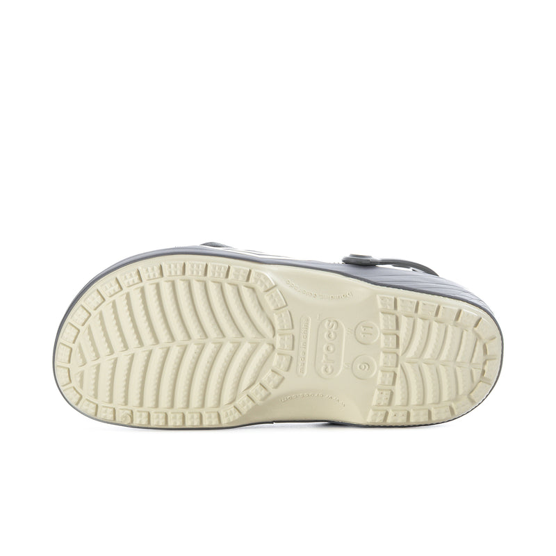 Men's clog outsole view with beige traction tread and ridged pattern