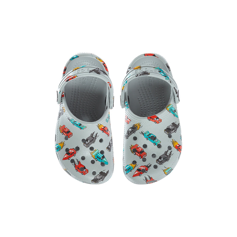 Toddler clog pair viewed from top, light gray with race car pattern