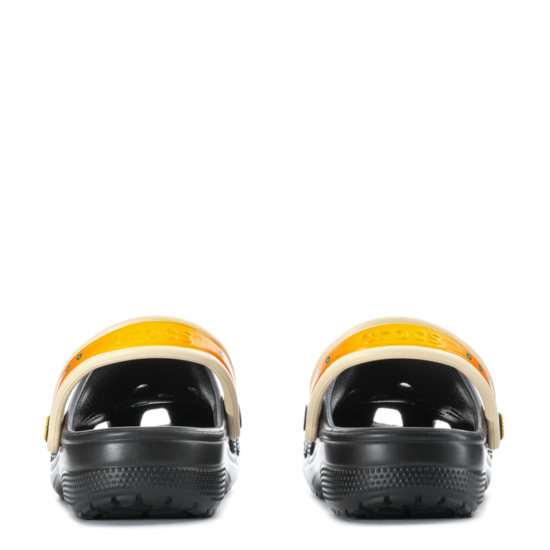 Black clog heels with cream collar and orange trim around opening