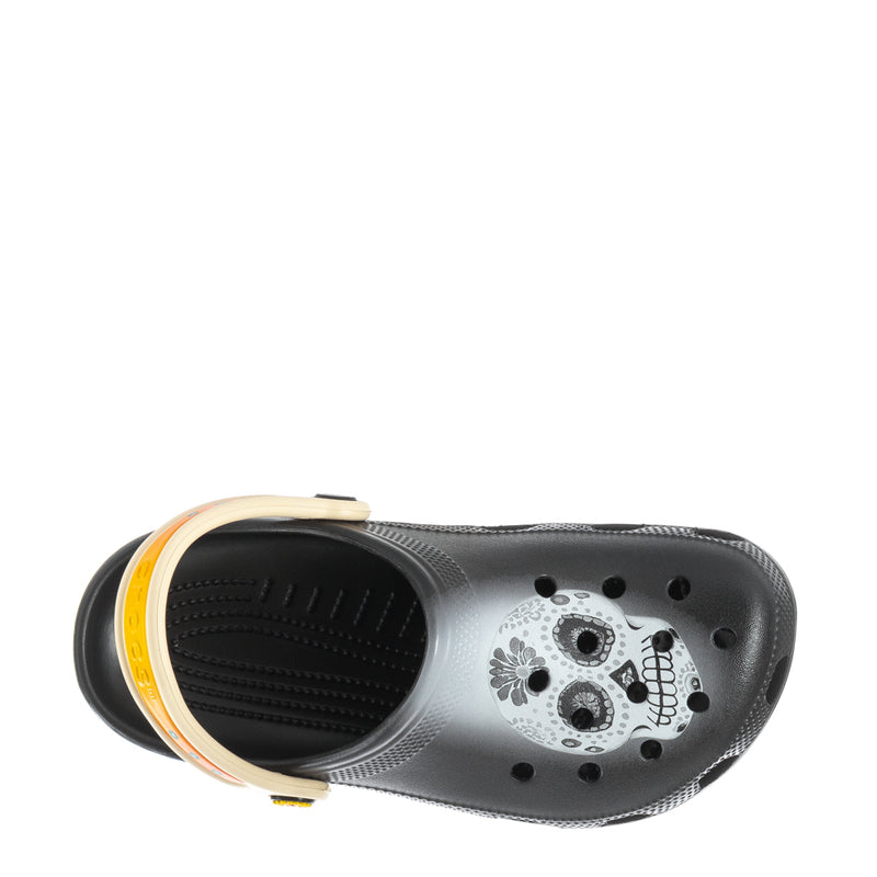 Black clog with white skull graphic on perforated upper