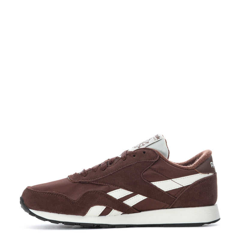 Men's brown low-top sneaker with white stripes, lace-up front, and rubber sole
