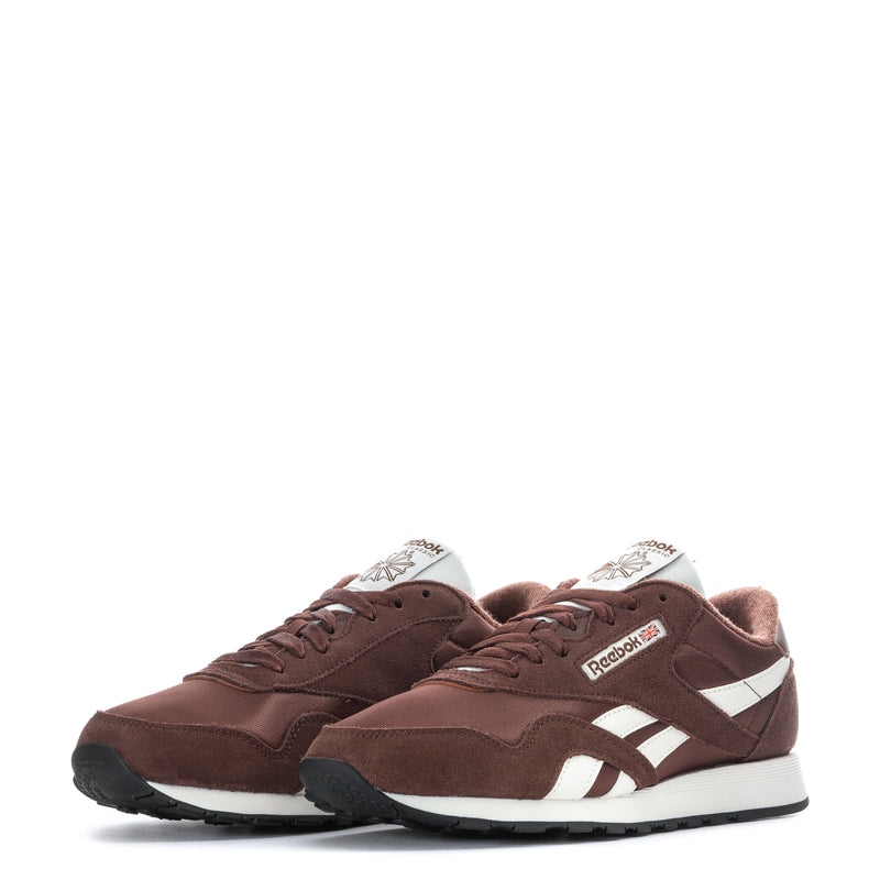 Men's brown lace-up sneakers with white stripes and Reebok logo on tongue