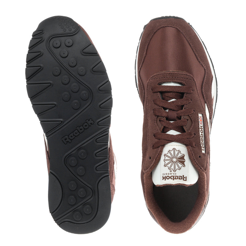 Men's sneaker outsole and lace-up interior, brown upper with white logo details