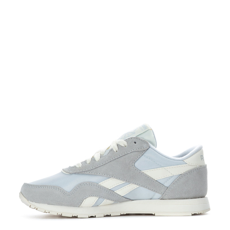Women's lace-up sneakers with gray suede panels, light blue accents, and white stripes