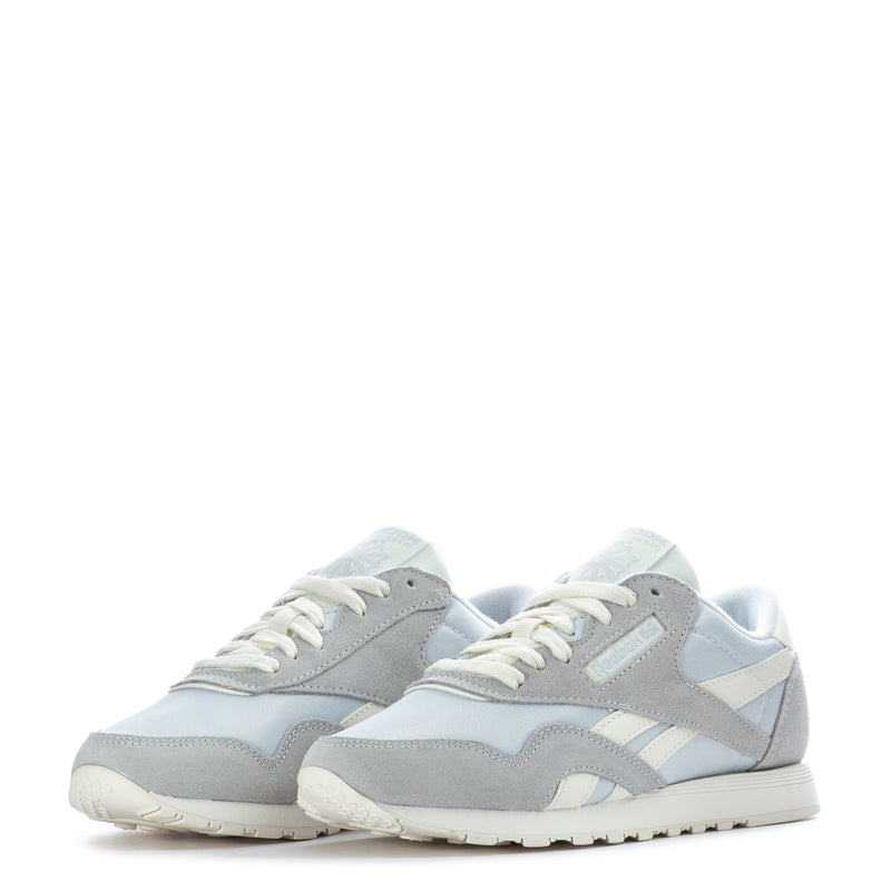 Pair of women's low-top sneakers in light gray and light blue with white laces