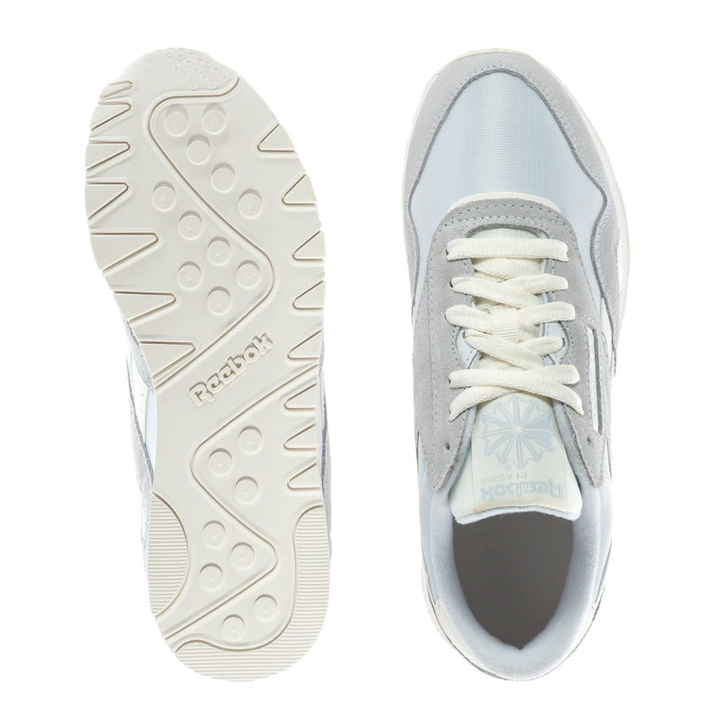 Shoe outsole and side view of women's sneakers with grippy tread and blue lining