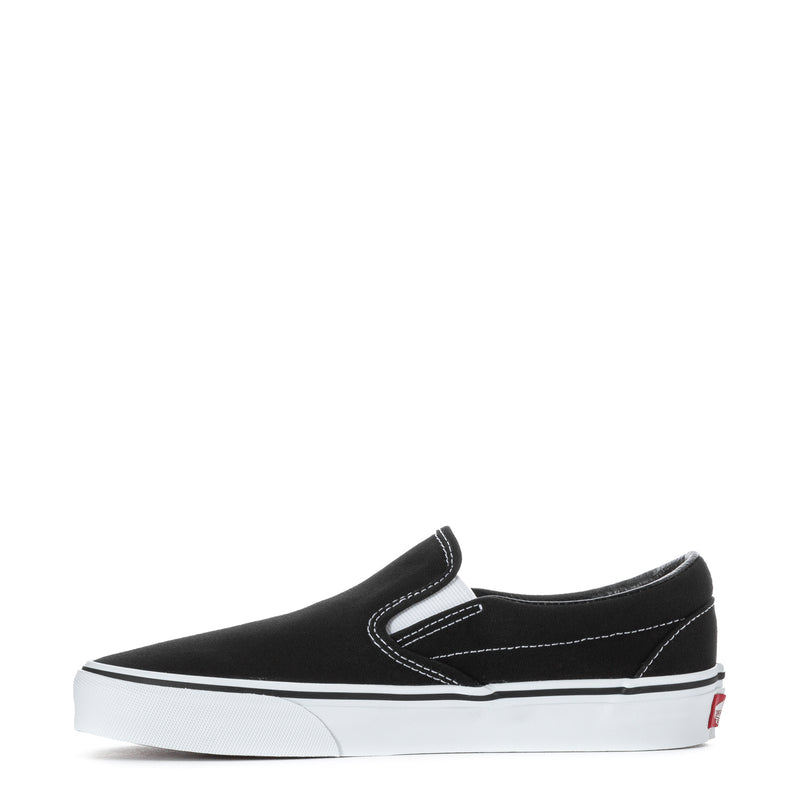 Black slip-on sneakers with white stitching, padded collar, and side stripe accents