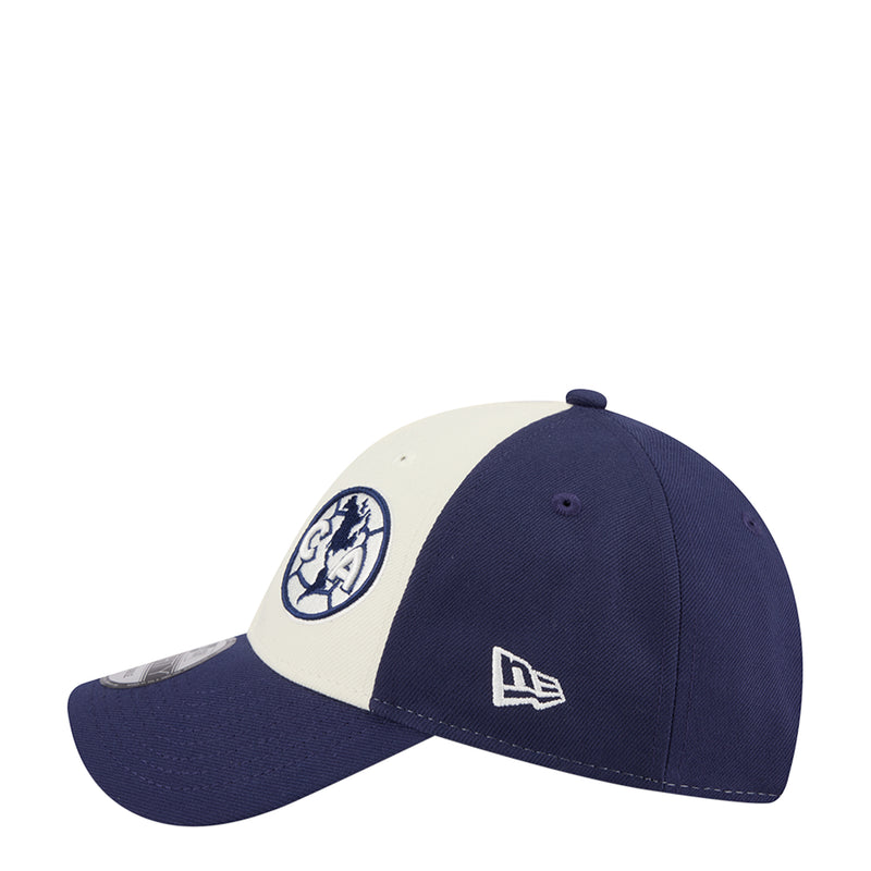 Two-tone baseball cap in navy and white with front crest and New Era logo