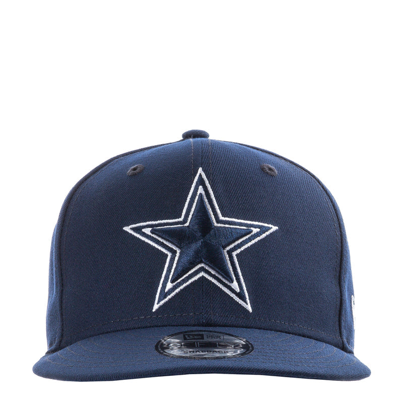 Navy baseball cap with white star logo on front