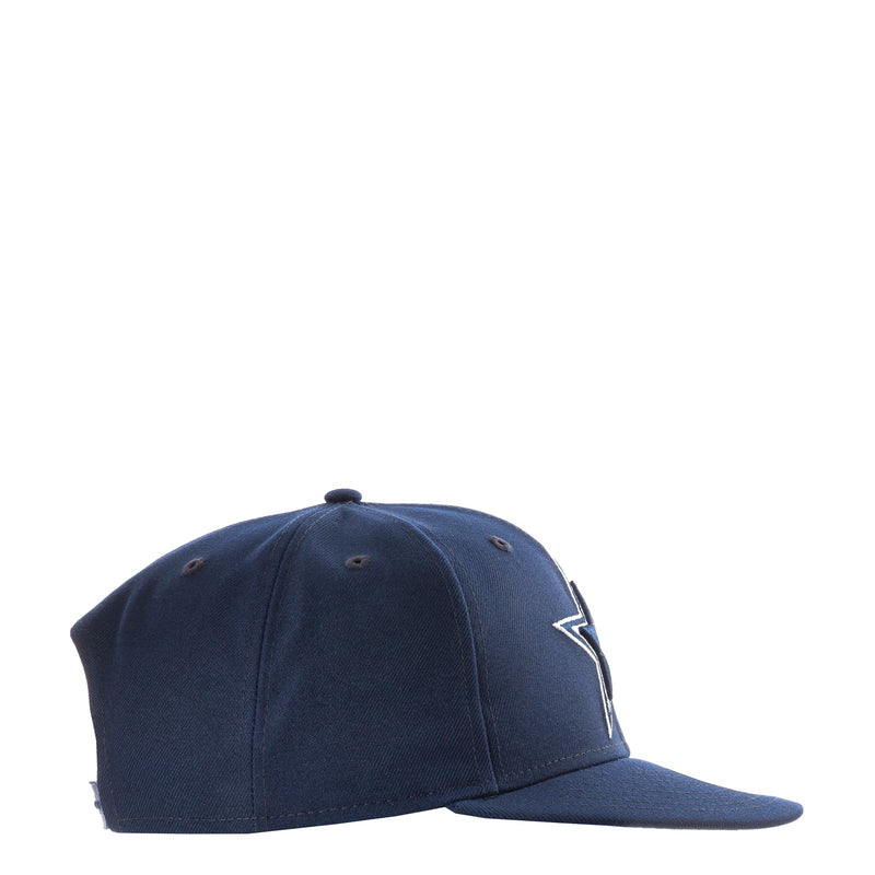 Navy baseball cap side view with embroidered emblem
