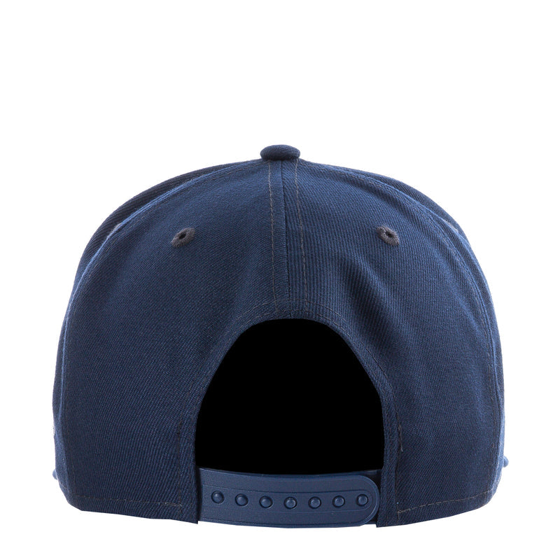 Navy baseball cap back view with ventilation eyelets