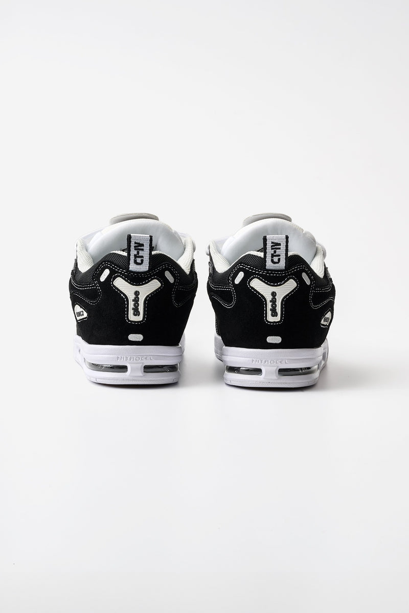Rear view of CT-4 black and white skate shoe showing suede upper and white sole