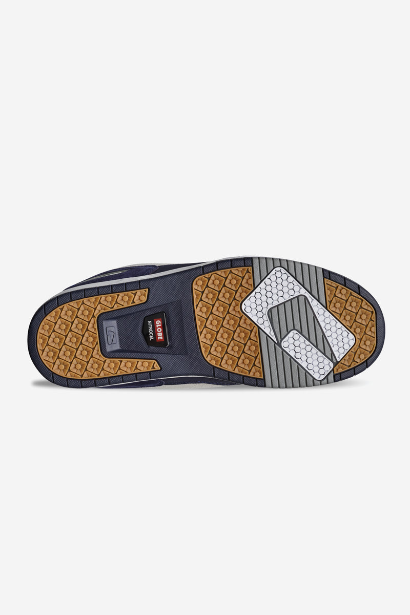 Bottom view of CT-4 sneaker in navy and white with gum outsole and tread blocks