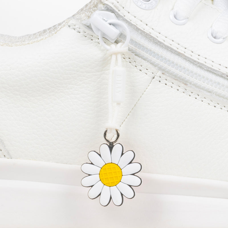 White daisy charm on a white background