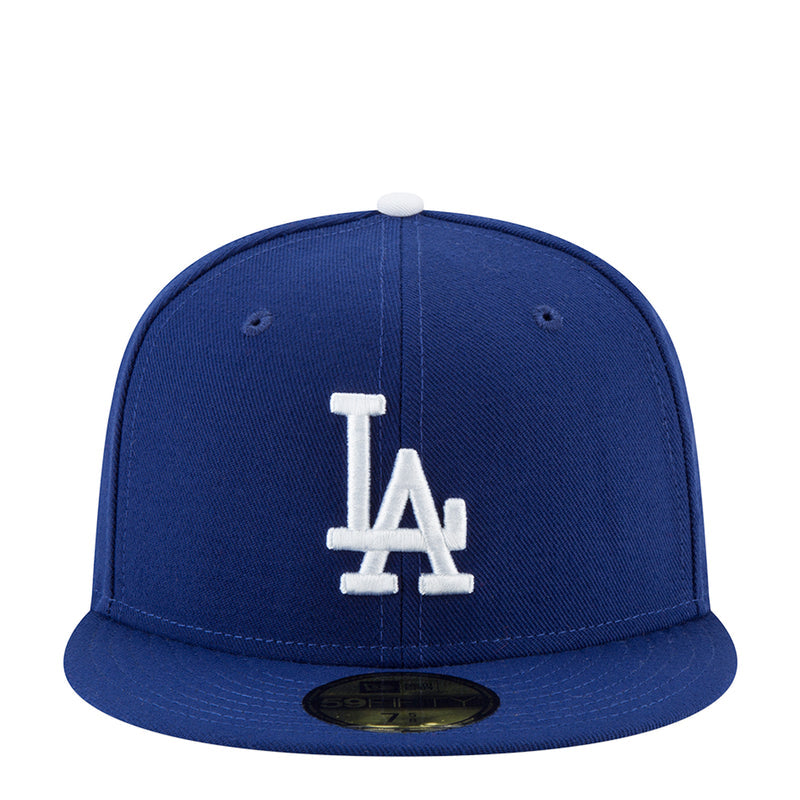 Royal blue baseball cap with white LA monogram front