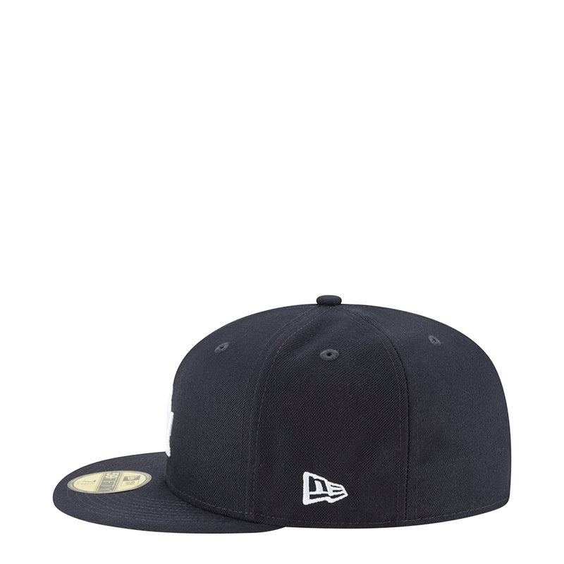 Navy baseball cap with New Era logo on front panel