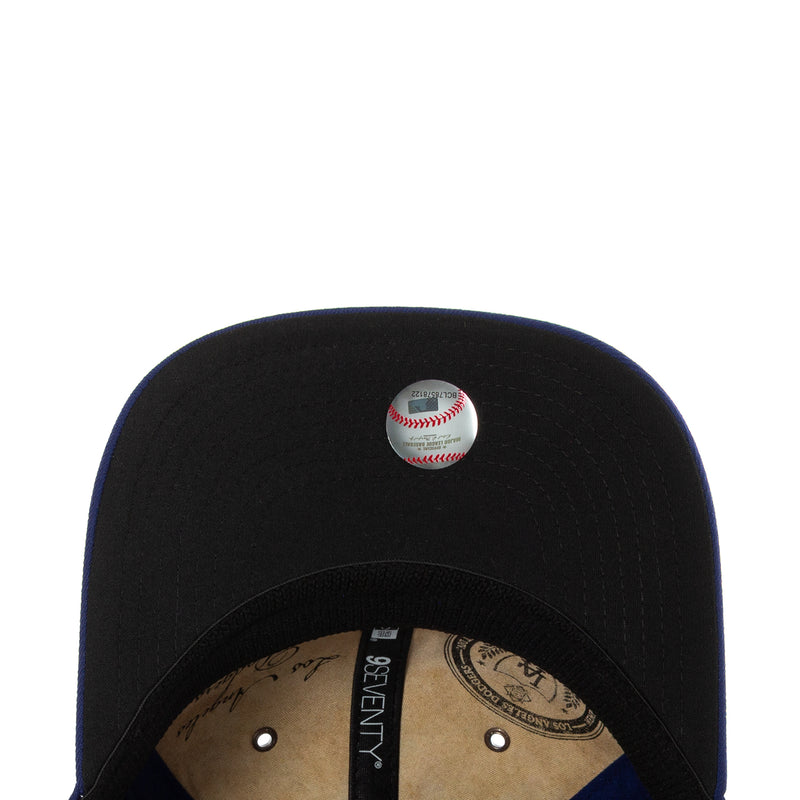 Black baseball cap with small baseball emblem on the crown