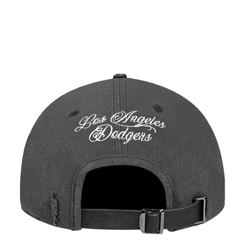 Black washed strapback baseball cap back with cursive graphics and adjustable buckle strap