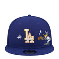 Navy baseball cap with LA logo and Daffy Duck patch, adjustable snapback
