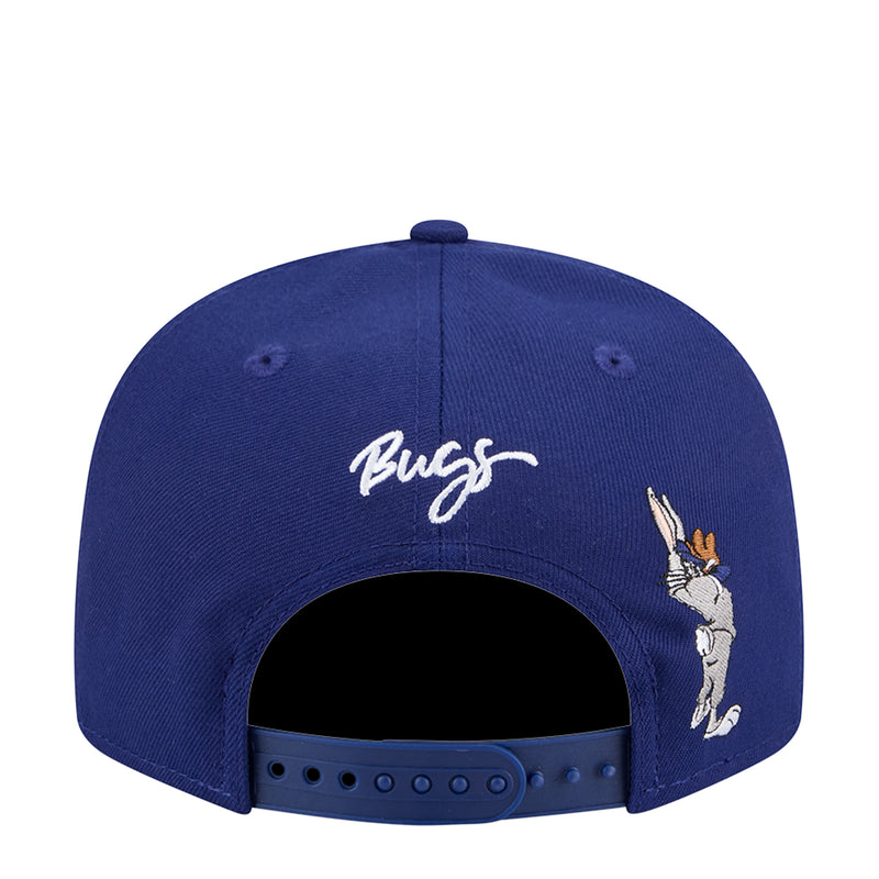 Navy snapback cap with 'Bugs' script and Bugs Bunny graphic on back.
