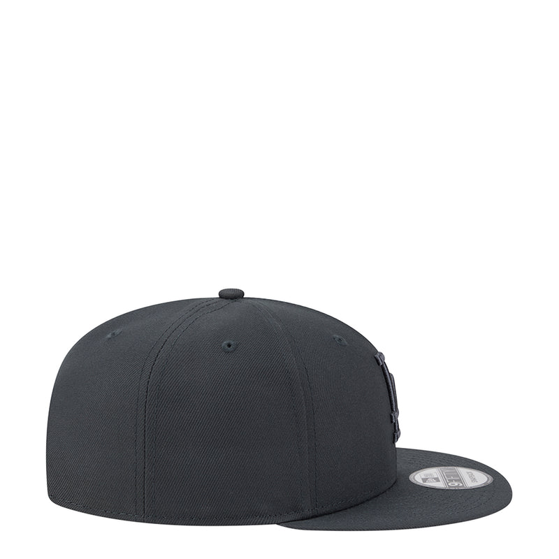 Dark charcoal baseball cap, side profile with curved brim and snapback strap