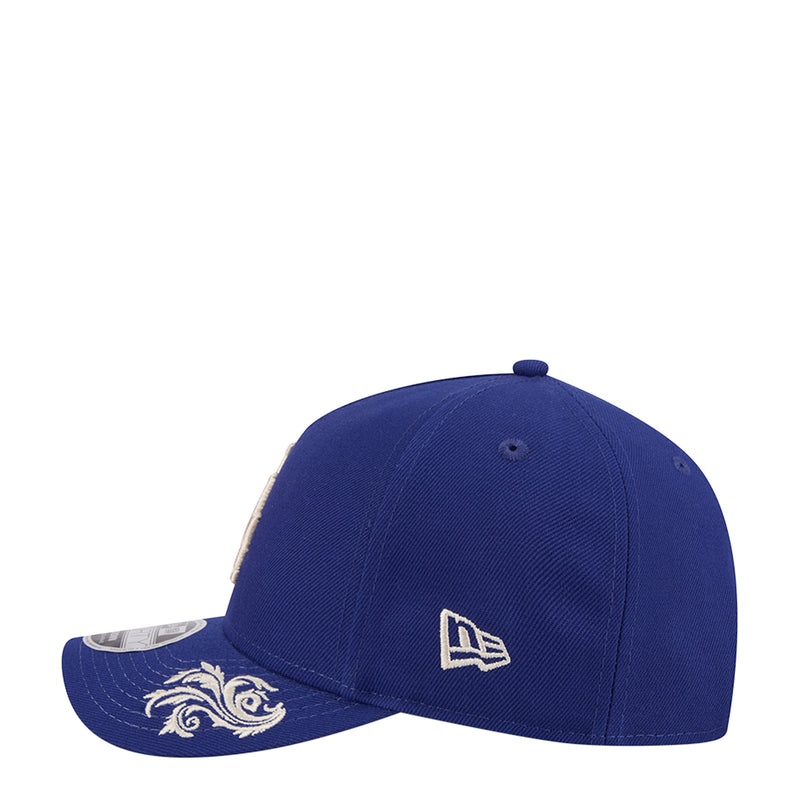 Blue baseball cap with curved brim and small New Era logo on the side panel