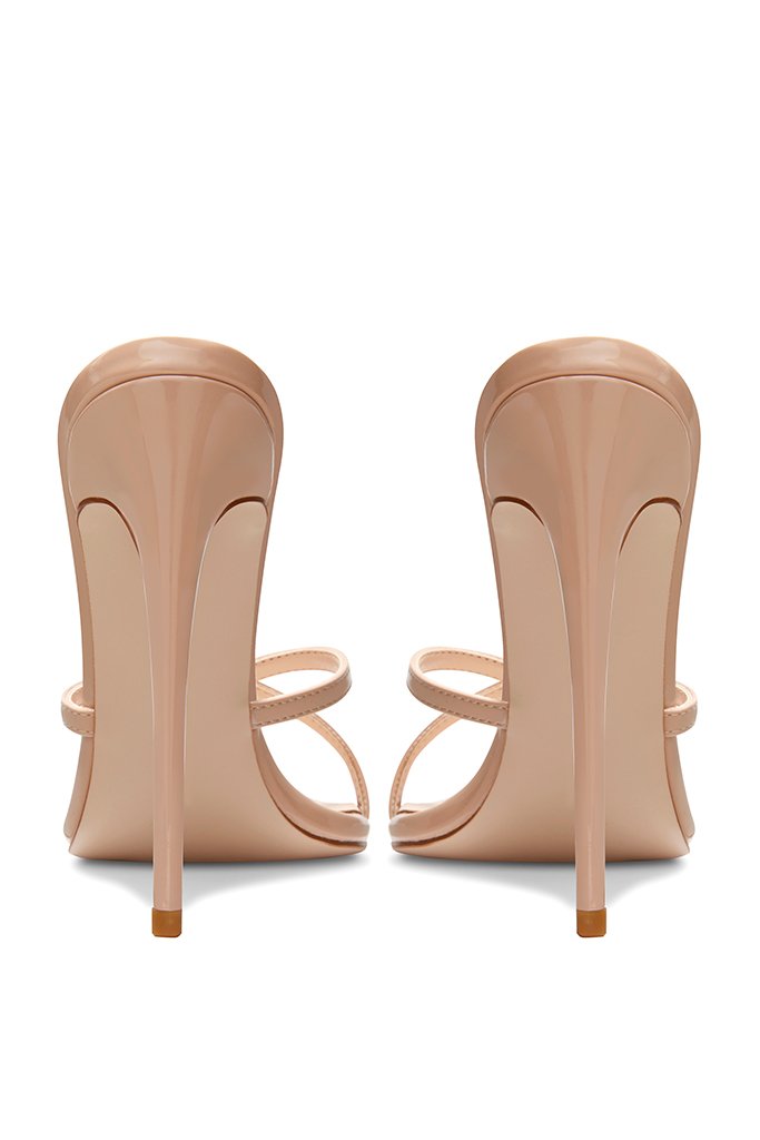 Femme LA Donatella Mule in Nude – back pair view, nude patent heel counters, slim stilettos, crossed straps visible from behind