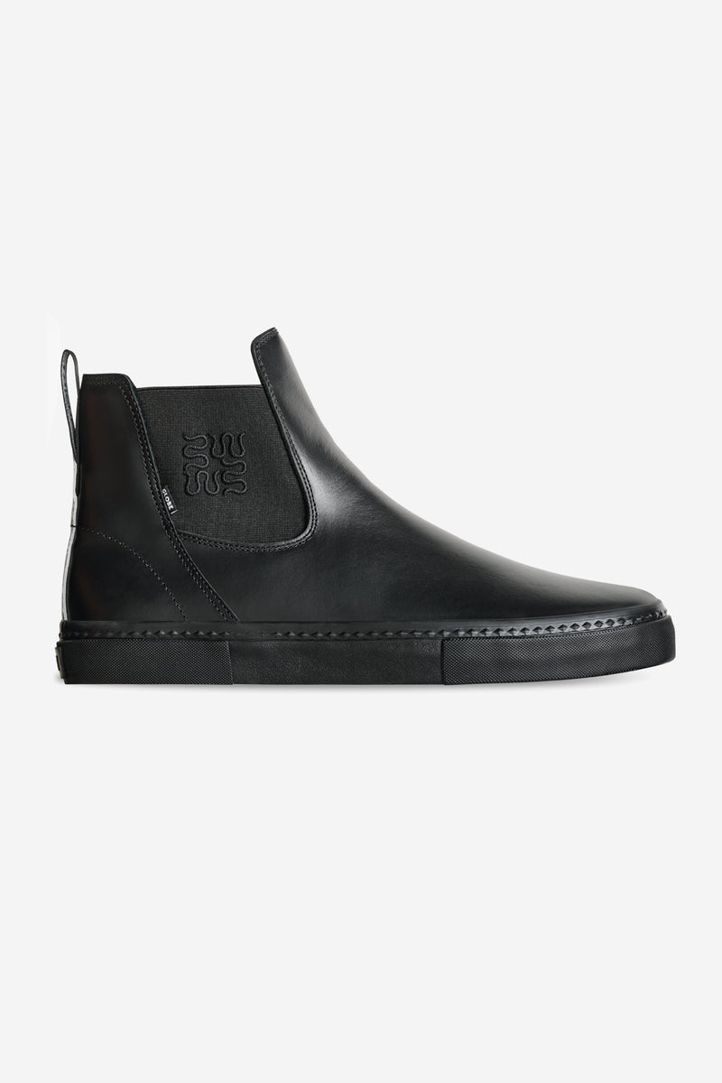 Dover II skate boot in Wasted Talent Black Snake side profile with black leather upper and elastic gusset