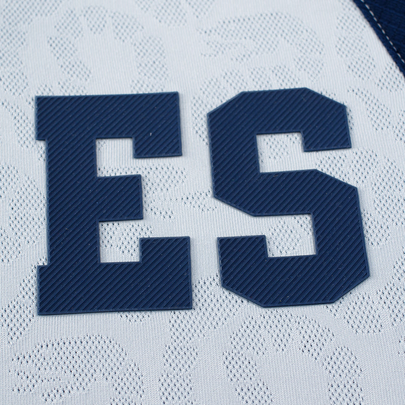 Raised blue ES lettering on light grey patterned football jersey