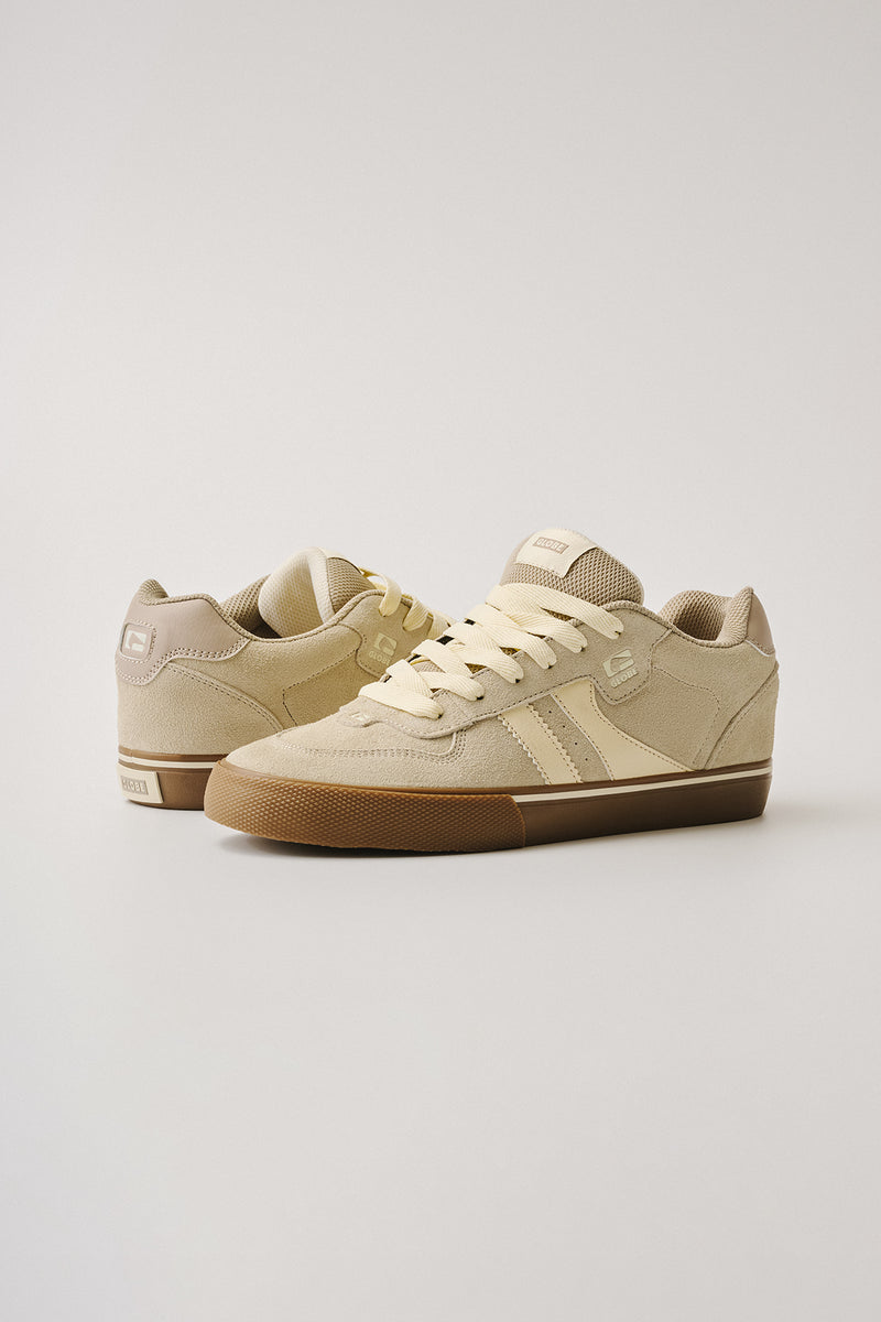 Pair of beige Encore-2 sneakers with cream laces and gum soles shown from a side angle on a light background