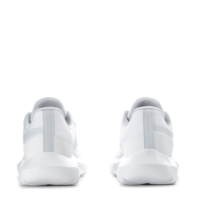 Pair of white women's sneakers heel view with cushioned ankle collar