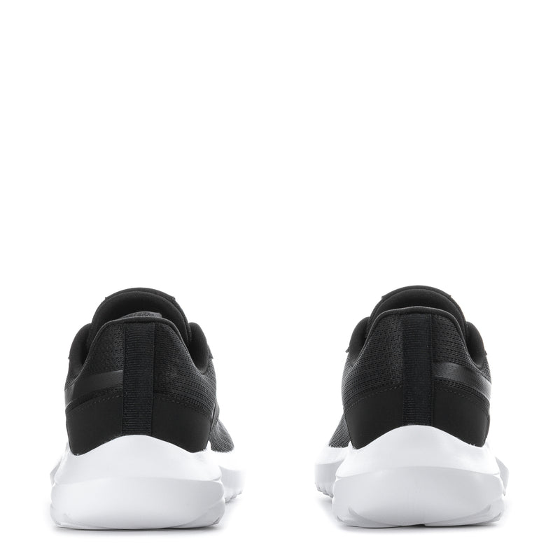 Youth black sneakers heel view with cushioned collar and white sole