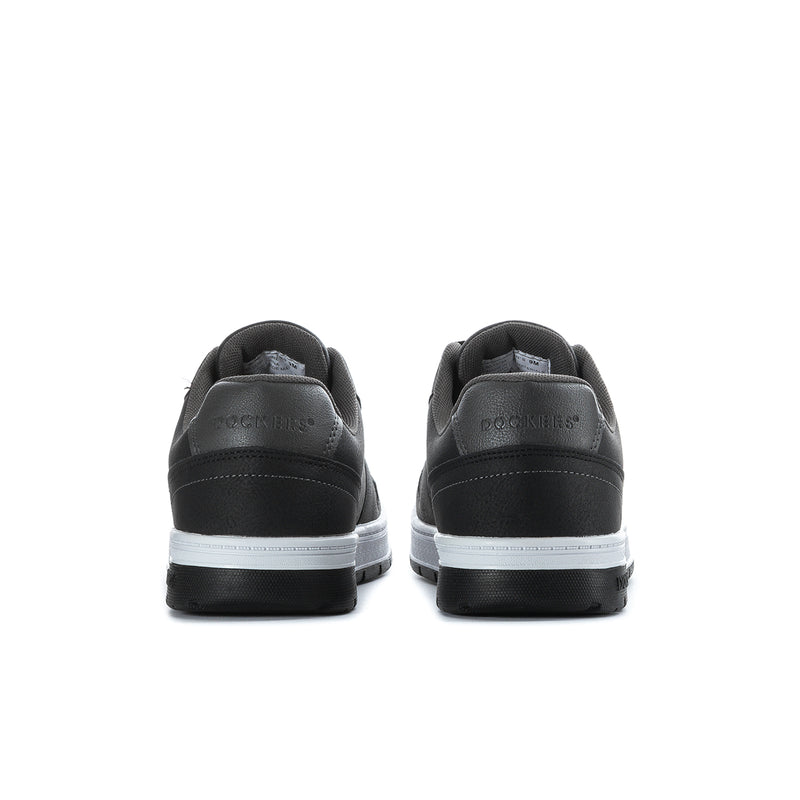 Black low-top sneakers with rear heel tabs and white stripe on sole