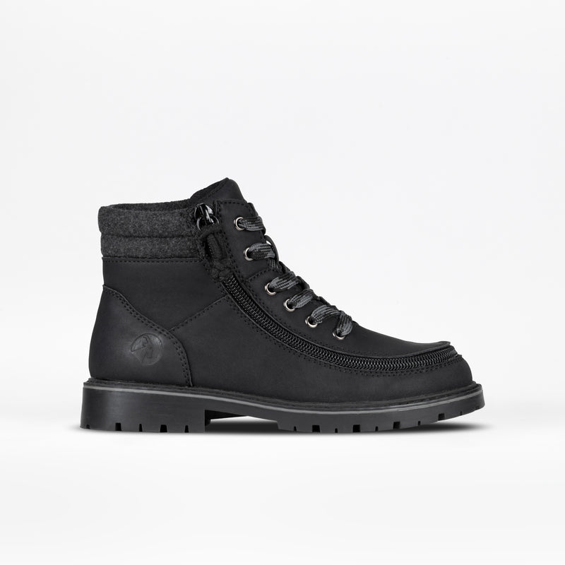 Black lug boot with a zipper on a white background