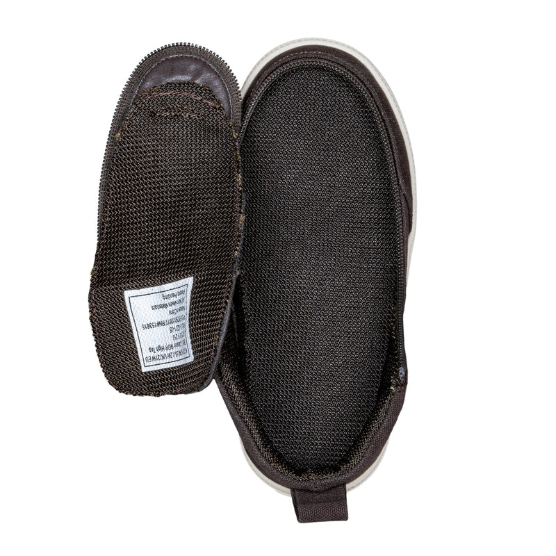 The FINAL SALE - Brown BILLY Classic D|R High by BILLY Footwear is shown from above: one shoe upright, the other flipped to reveal the mesh-texture sole and a white tag. Removable insoles make them ideal as extra wide kids shoes.