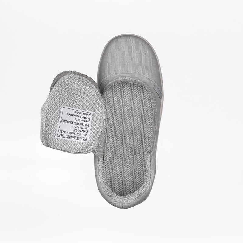 A top view of the FINAL SALE - Grey BILLY D|R Short Wrap Low Tops by BILLY Footwear, a light gray kids' adaptive slip-on shoe with an open hook-and-loop strap showing the white label inside, displayed on a plain white background.