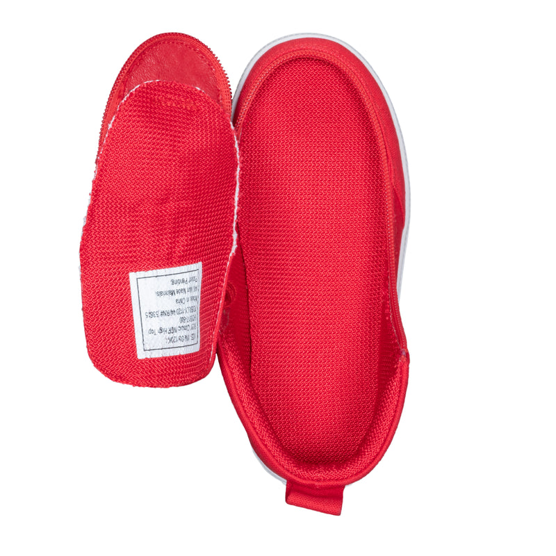 A pair of small red BILLY Footwear FINAL SALE - Red BILLY Classic D|R High kids orthopedic shoes are shown on a white background, one upright and one flipped to reveal the white label inside. Both have white soles.