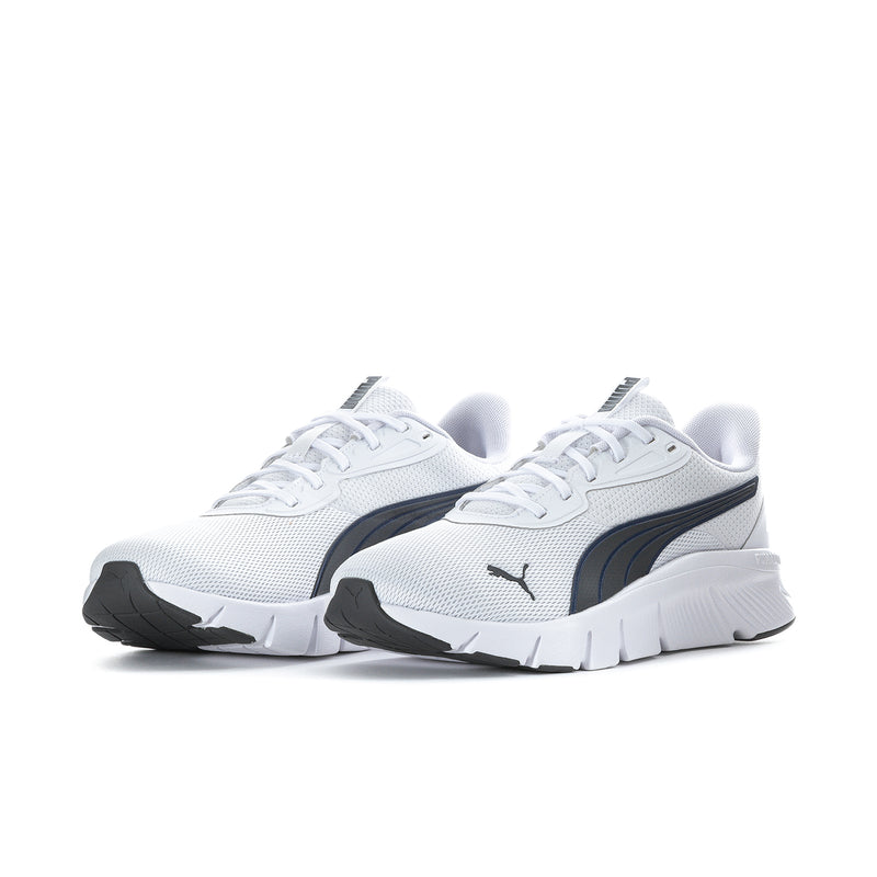 Pair of men's white running shoes with black Puma stripe and thick sole
