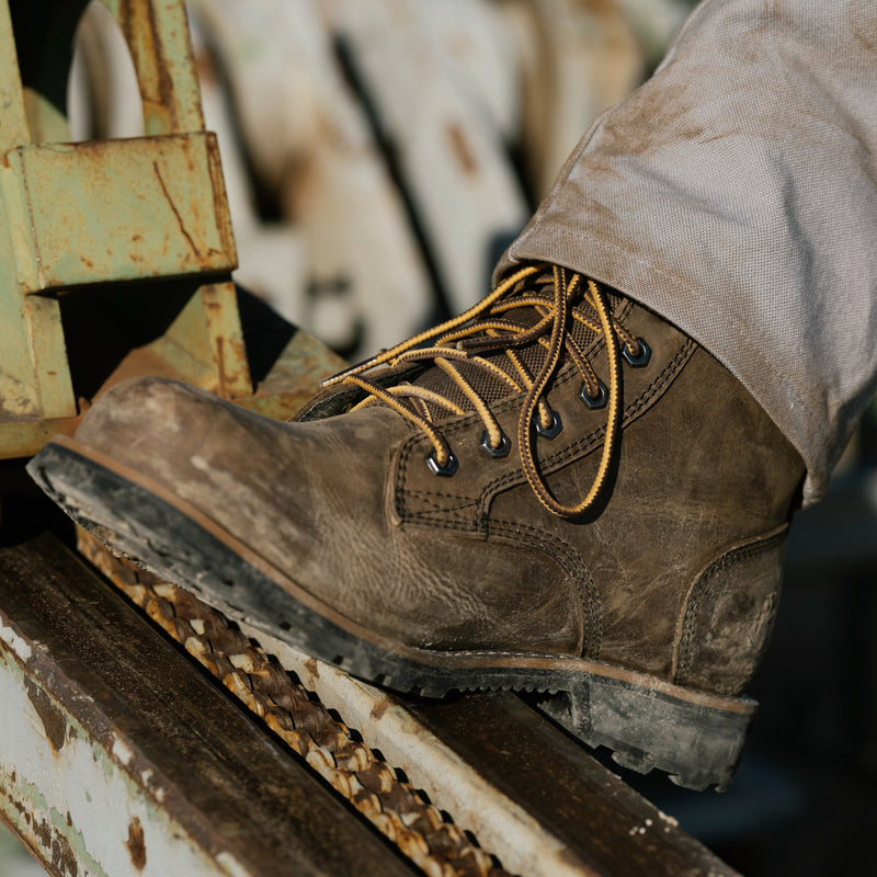 Brown 6-inch lace-up work boot with textured sole and tan laces