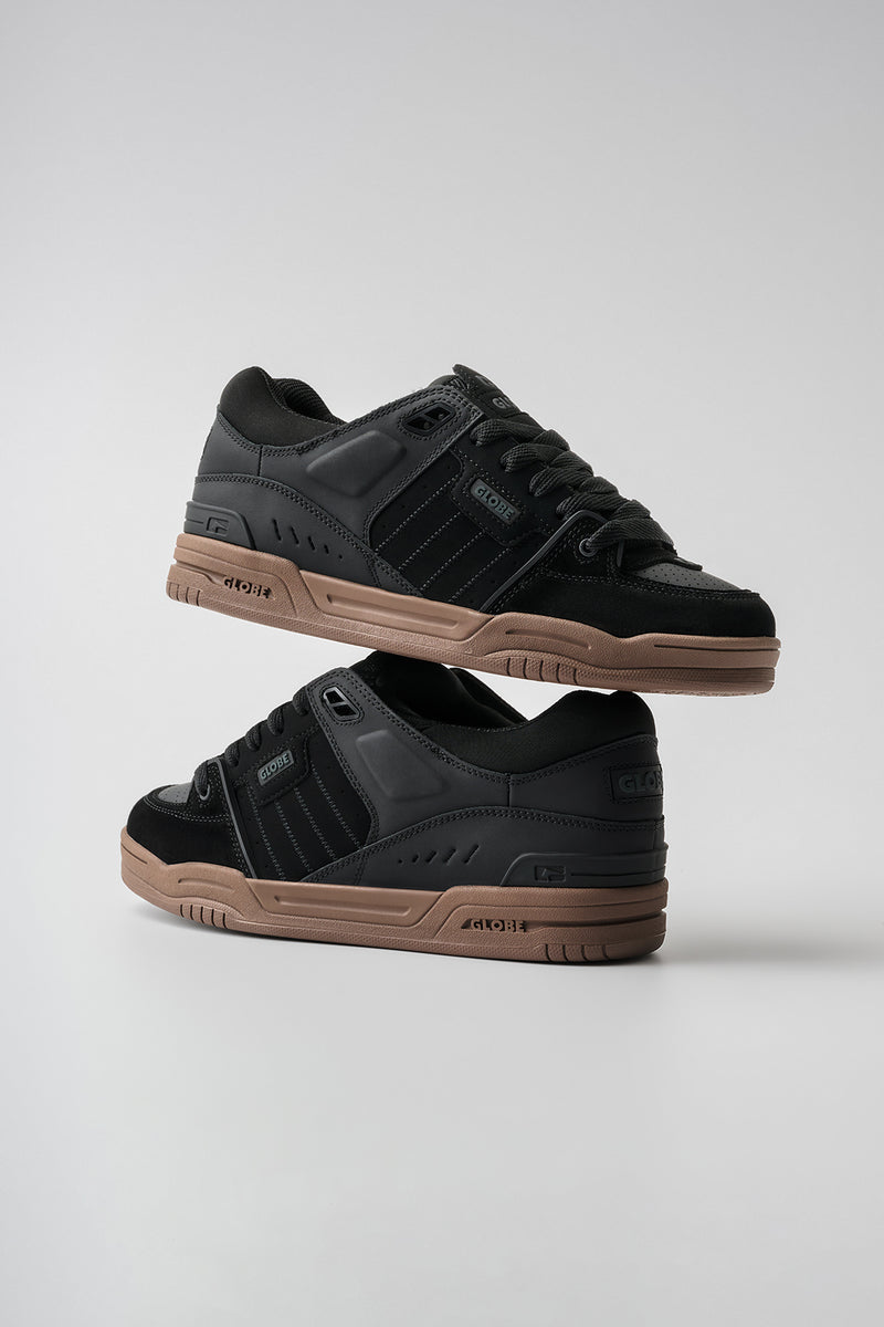 Fusion skate shoe in black with tobacco gum sole and padded upper