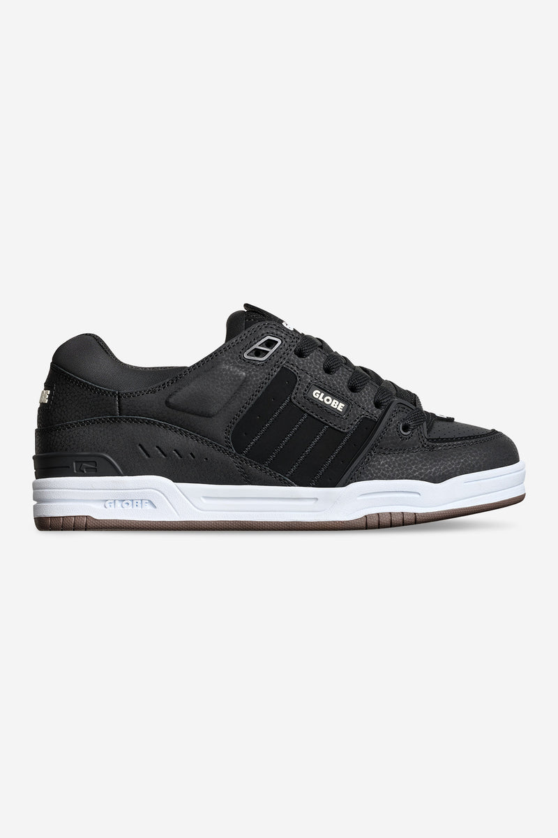 Fusion skate shoe in black with white midsole and gum outsole, side profile view