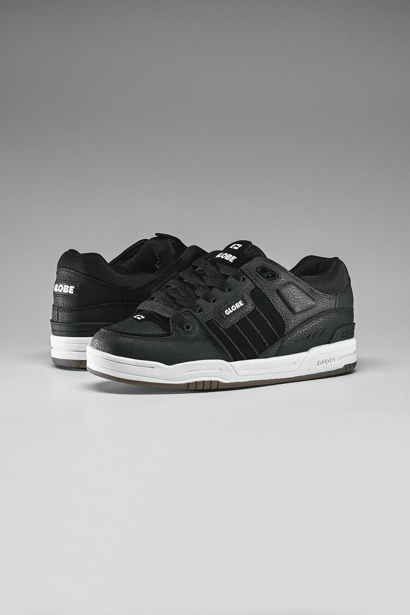 Fusion skate shoes in black with white midsole and gum outsole shown as a pair against a gray backdrop