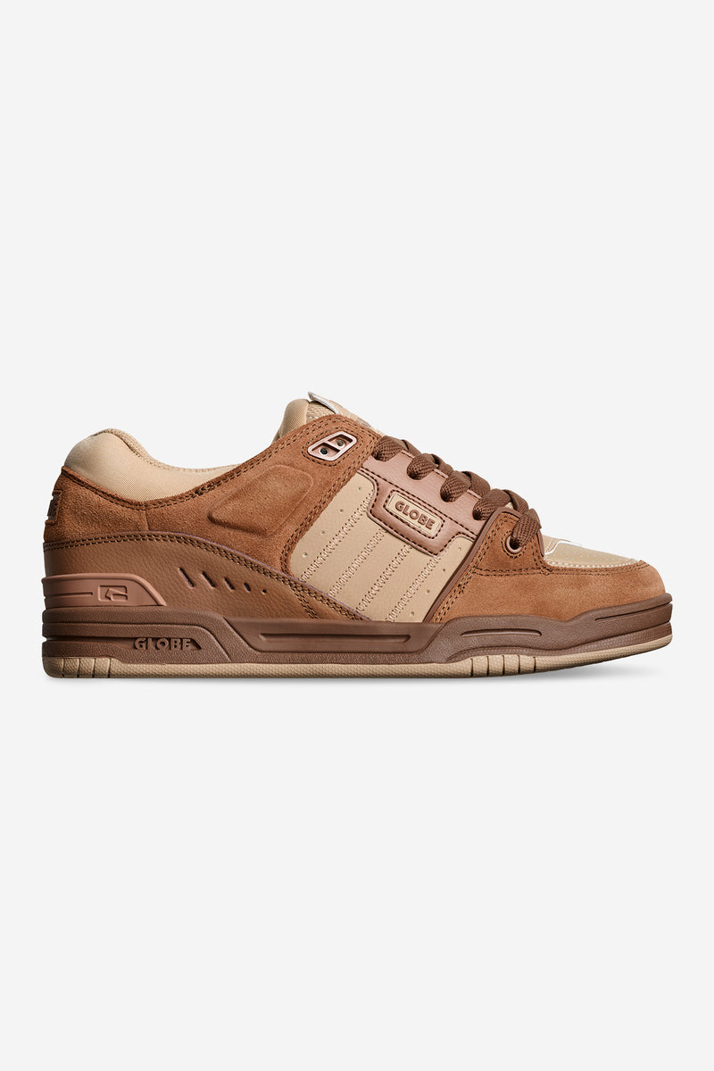 Side view of walnut brown Fusion skate shoe with suede and leather panels and Globe branding.