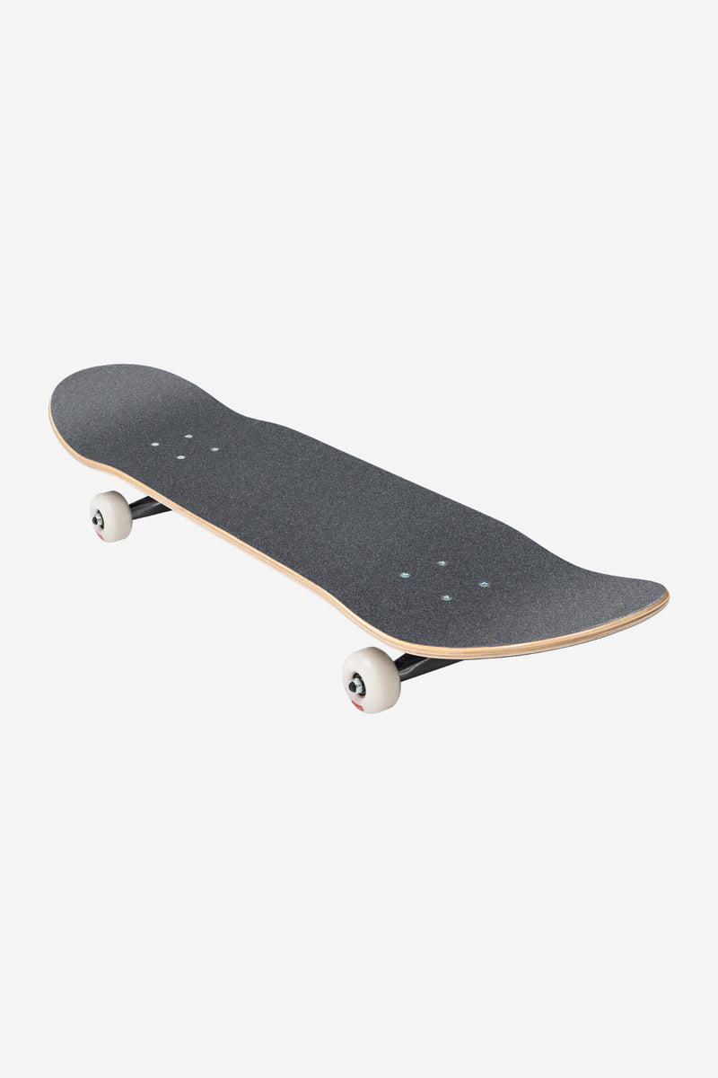 Diagonal angled view of the G0 Technotrap complete skateboard with dark grip tape and white wheels