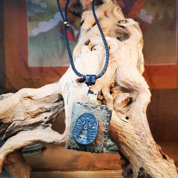 Gandhanra Antique Amulet Pendant,Stupa / Pagoda Tsa Tsa Mold on leather Sachet - Tibetan Buddhist amulet, close-up detail